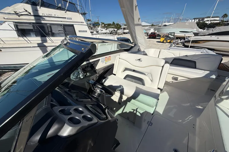 Slide: The Image of 2014 Monterey 328SS Super Sport boat interior with steering wheel and seating. - 74