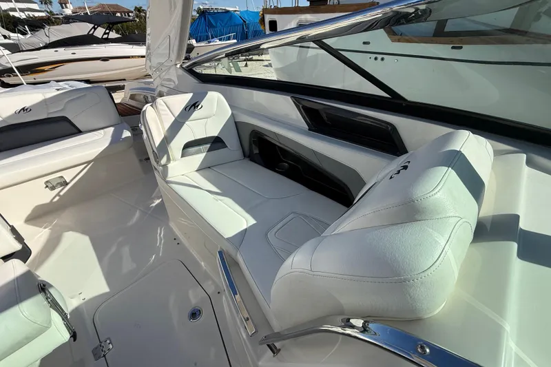 Slide: The Image of 2014 Monterey 328SS Super Sport boat interior with white leather seating. - 75