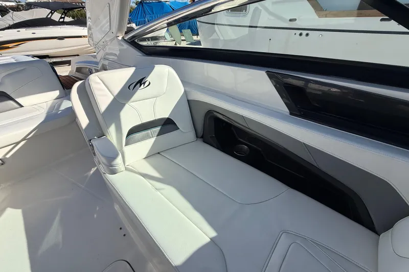 Slide: The Image of 2014 Monterey 328SS Super Sport boat interior with white leather seating. - 78
