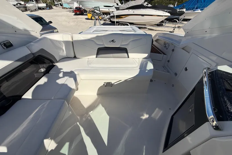 Slide: The Image of Interior of a 2014 Monterey 328SS Super Sport boat with white seating and modern design. - 79