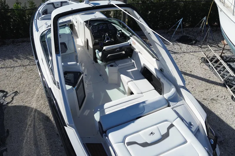 Slide: The Image of 2014 Monterey 328SS Super Sport boat with sleek interior and modern dashboard design. - 8