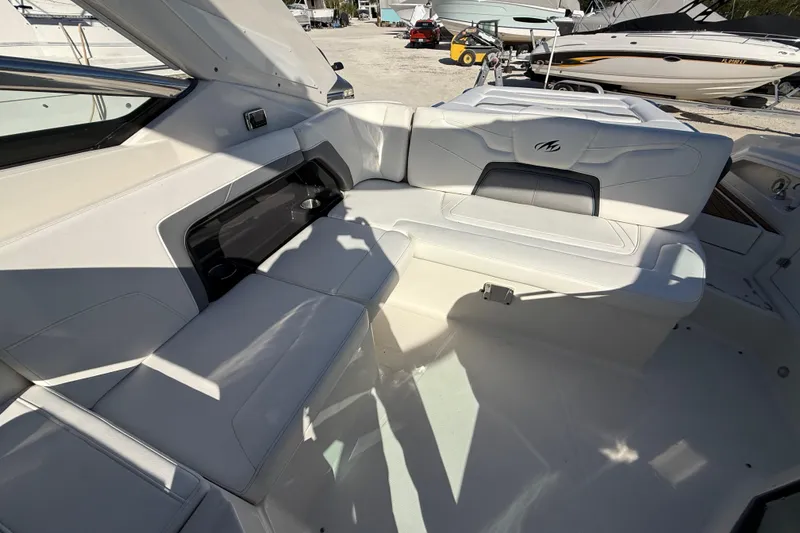 Slide: The Image of Interior of a 2014 Monterey 328SS Super Sport boat with white seating. - 80