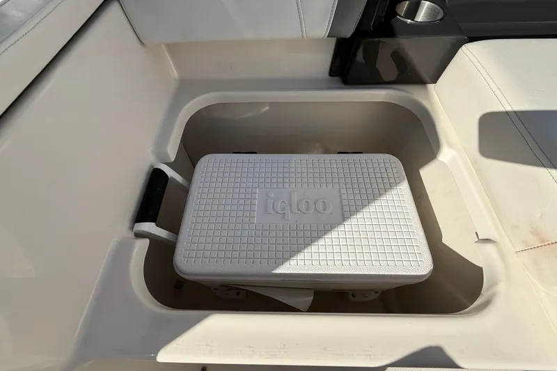 Slide: The Image of Storage compartment with Igloo cooler in 2014 Monterey 328SS Super Sport boat. - 83