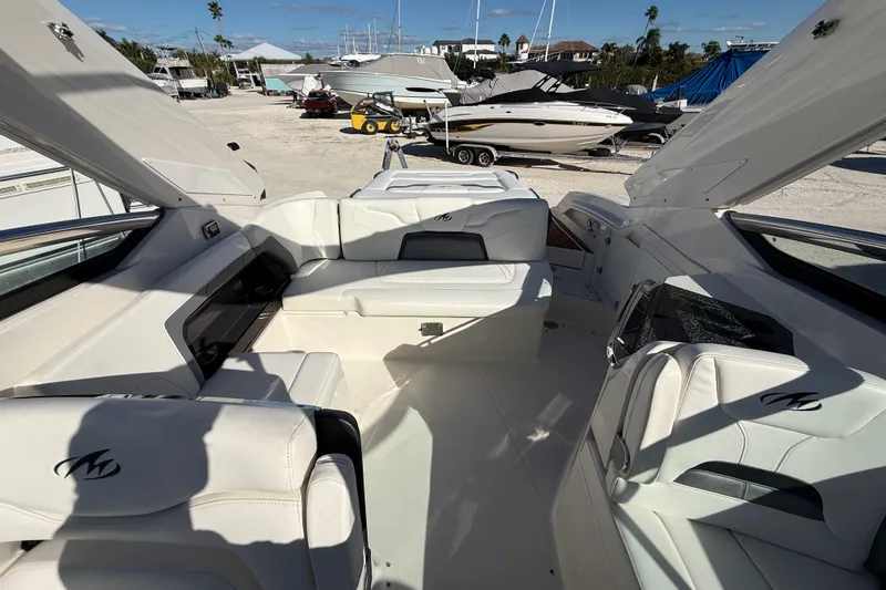 Slide: The Image of Interior of a 2014 Monterey 328SS Super Sport boat with white seating. - 86
