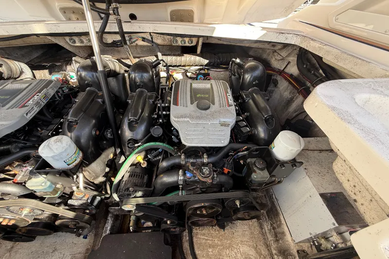 Slide: The Image of Engine compartment of a 2014 Monterey 328SS Super Sport boat, showcasing dual engines. - 89
