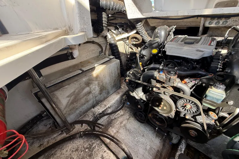 Slide: The Image of Engine compartment of a 2014 Monterey 328SS Super Sport boat, showcasing mechanical components. - 90