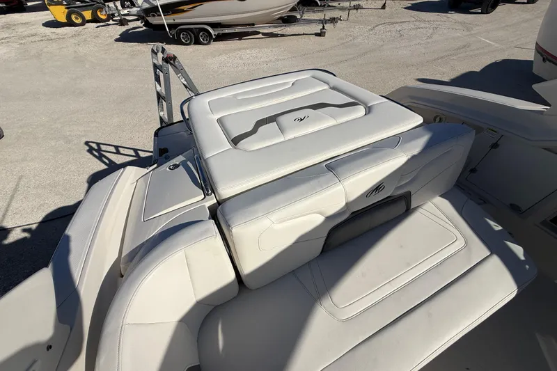 Slide: The Image of 2014 Monterey 328SS Super Sport boat with white leather seating in a sunny outdoor setting. - 92