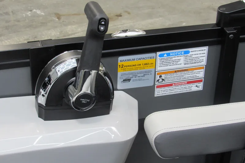 Slide: The Image of Throttle control of 2026 Viaggio Lago X22U boat with capacity and safety labels. - 12