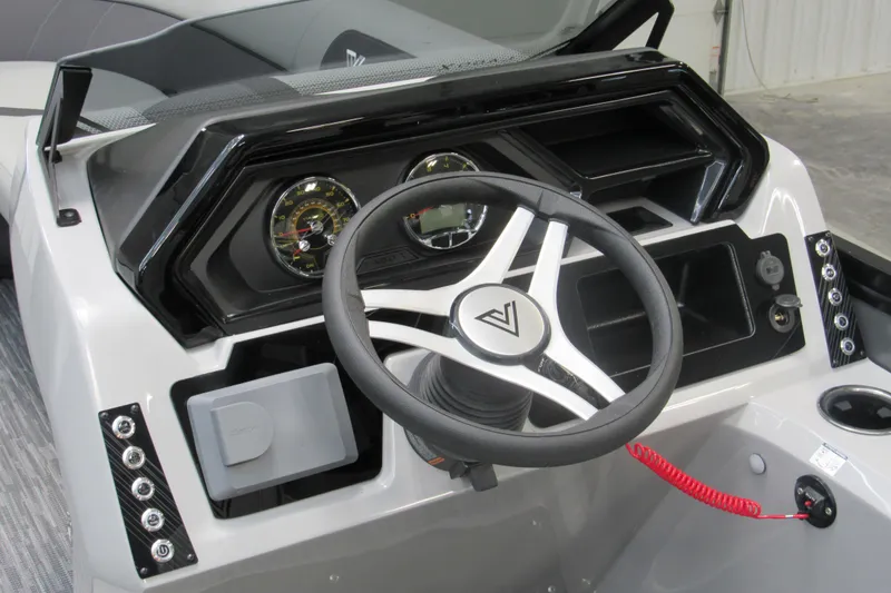 Slide: The Image of 2026 Viaggio Lago X22U boat dashboard with steering wheel and control panel. - 5