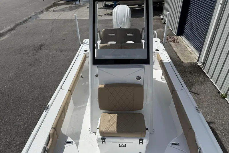 Slide: The Image of 2026 Blazer Bay 2440 boat with tan seating and sleek design. - 16