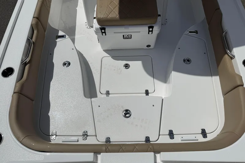 Slide: The Image of Interior view of 2026 Blazer Bay 2440 boat, featuring seating and storage compartments. - 17