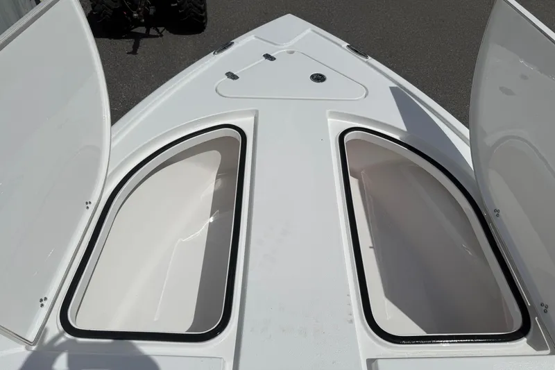 Slide: The Image of Open storage compartments on a 2026 Blazer Bay 2440 boat deck. - 20