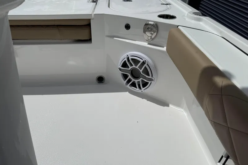 Slide: The Image of 2026 Blazer Bay 2440 boat interior with speaker and cushioned seating. - 23