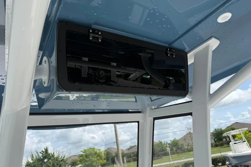 Slide: The Image of 2026 Blazer Bay 2440 boat interior with blue ceiling and mounted equipment. - 27