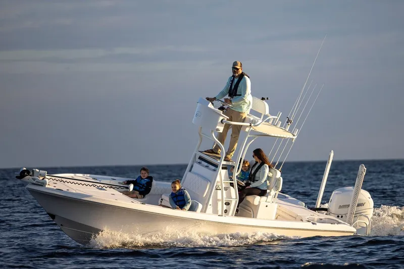 Slide: The Image of 2026 Blazer Bay 2440 boat cruising with family on open water. - 3