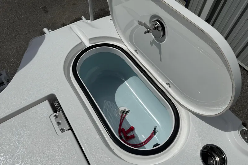 Slide: The Image of Open storage compartment on 2026 Blazer Bay 2440 boat, featuring a sleek design. - 36