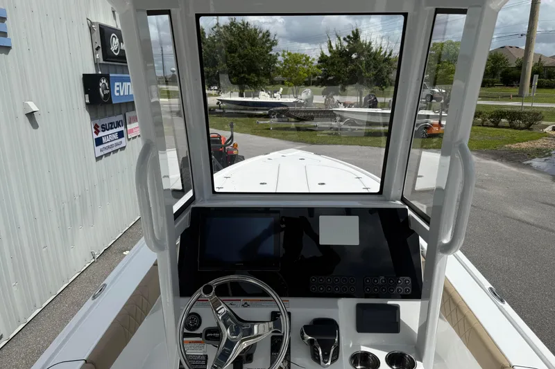 Slide: The Image of Interior view of 2026 Blazer Bay 2440 boat cockpit with steering wheel and control panel. - 39