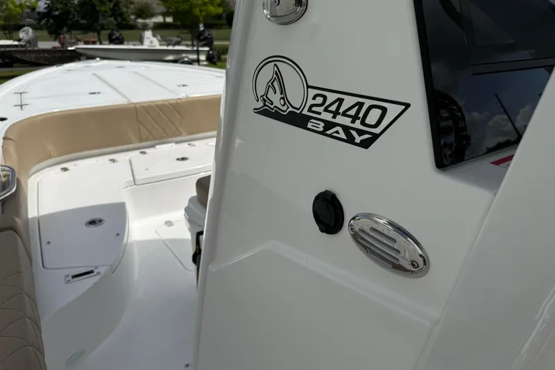 Slide: The Image of 2026 Blazer Bay 2440 boat interior with logo and seating detail. - 40
