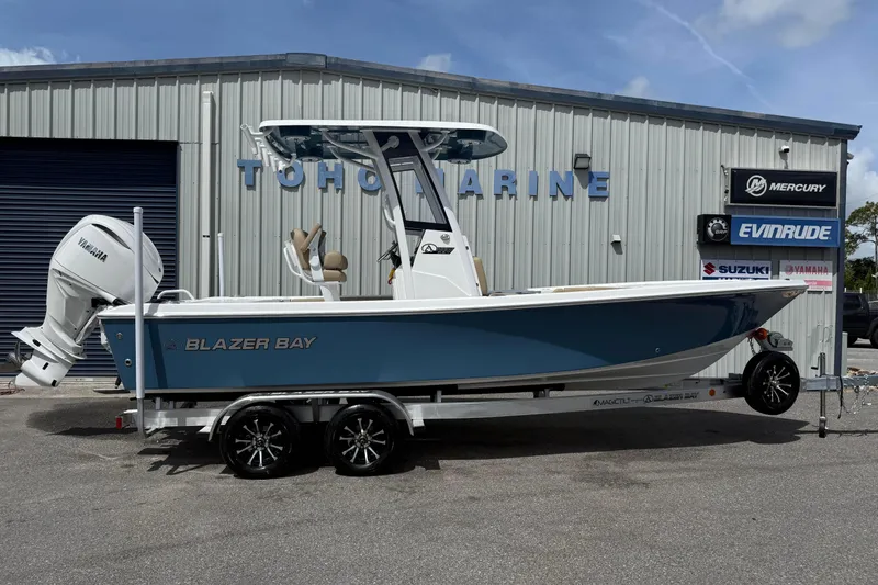 The Image of 2026 Blazer Bay 2440 boat on trailer at marine dealership. - 6