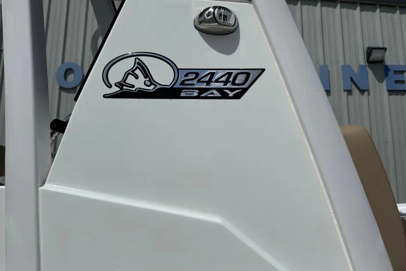 Slide: The Image of 2026 Blazer Bay 2440 boat logo on white surface, outdoor setting. - 8