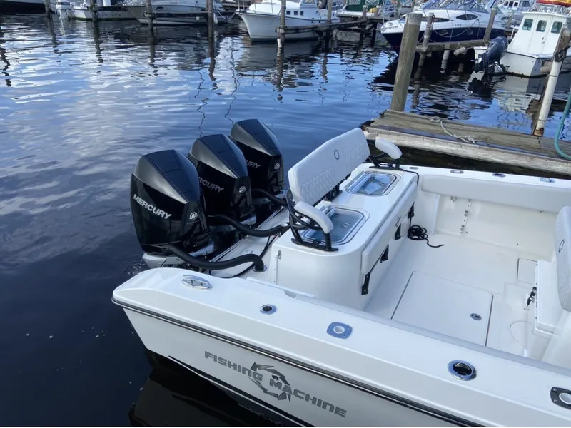 Slide: The Image of A 2021 Fountain 38 Tournament Edition boat with three Mercury outboard engines at the dock. - 5
