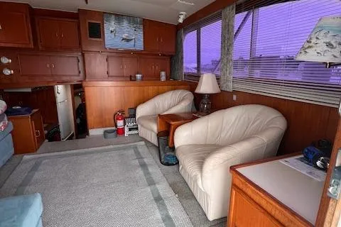 Slide: The Image of Interior of 1985 Post 43 Convertible yacht with leather chairs and wooden cabinetry. - 15