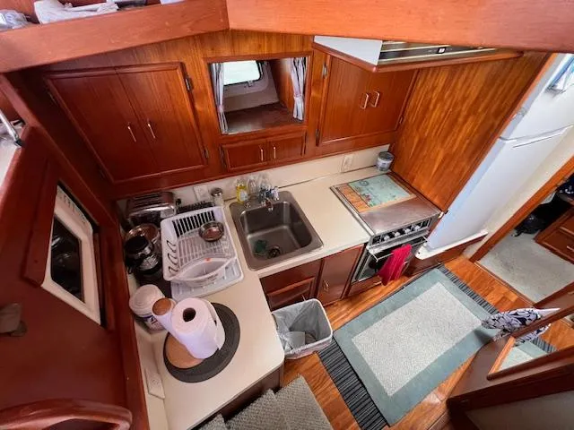Slide: The Image of 1985 Post 43 Convertible yacht kitchen with wooden cabinets and modern appliances. - 18