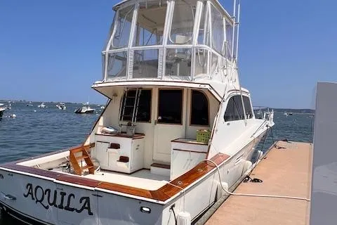 Slide: The Image of 1985 Post 43 Convertible yacht "Aquila" docked at marina. - 3