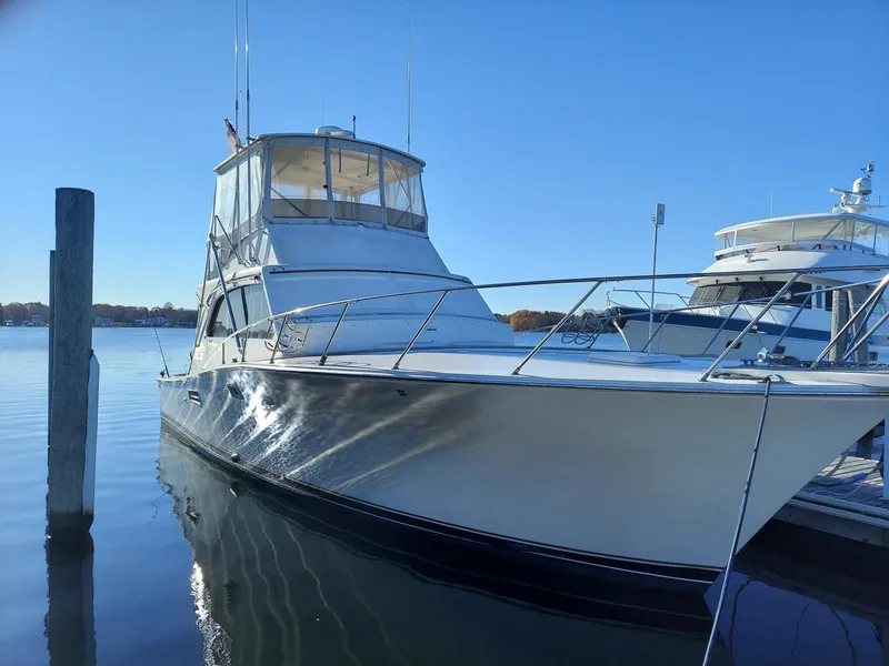 Slide: The Image of 1985 Post 43 Convertible yacht docked on a sunny day. - 5