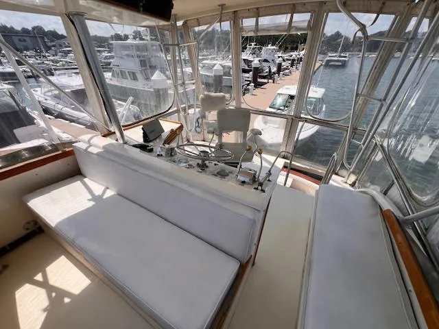 Slide: The Image of Interior of a 1985 Post 43 Convertible yacht at a marina. - 9