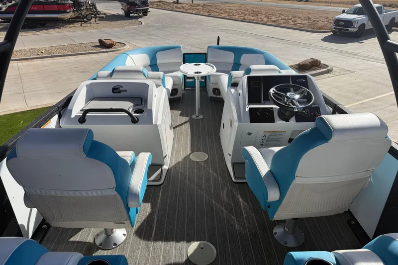 Slide: The Image of 2020 Montara Surf Boss boat interior with blue and white seating and steering console. - 11