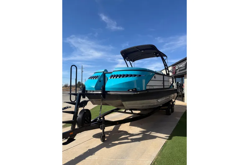 Slide: The Image of 2020 Montara Surf Boss boat on trailer under clear blue sky. - 4