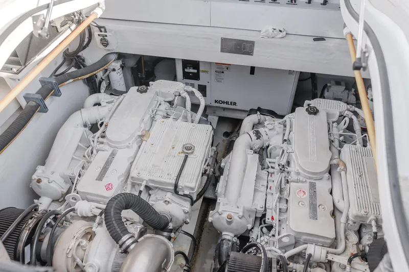 Slide: The Image of Engine room of a 2017 Custom 60 yacht with twin engines and Kohler generator. - 27