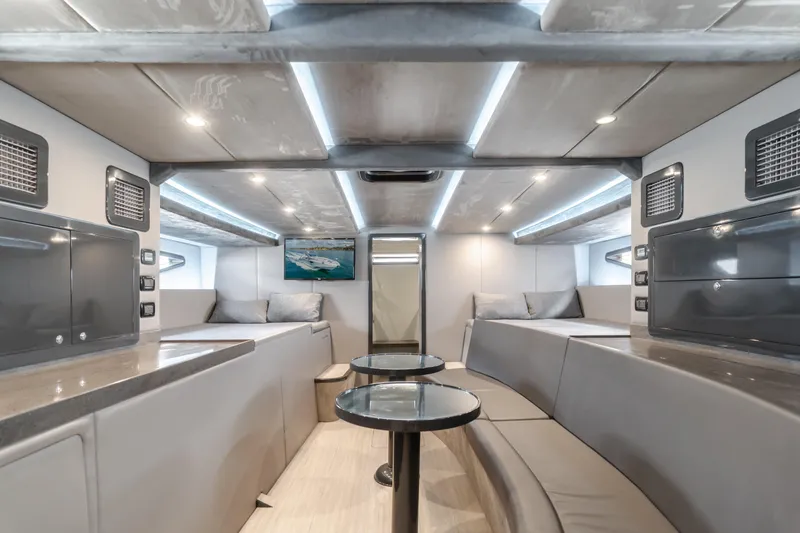 Slide: The Image of Luxurious interior of a 2017 Custom 60 yacht with modern seating and ambient lighting. - 28