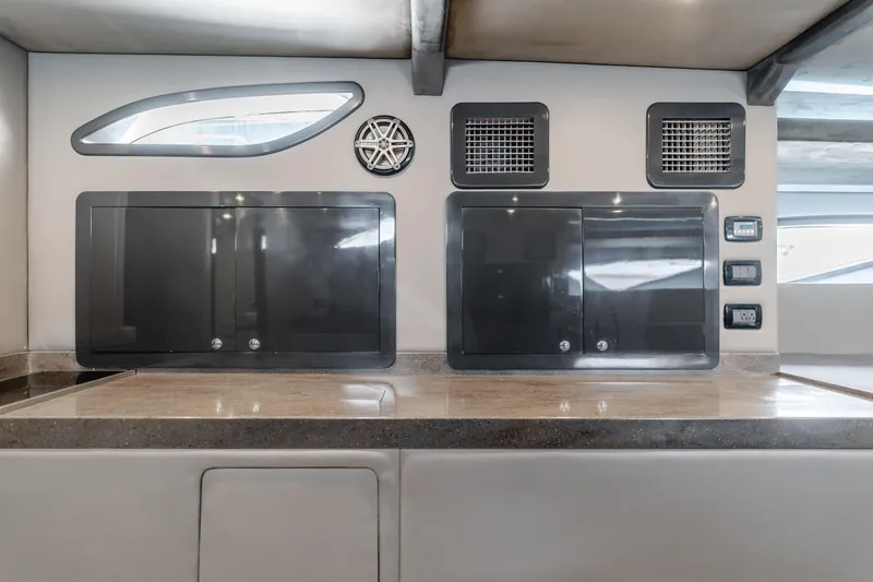 Slide: The Image of Modern yacht interior with sleek cabinets, speaker, and control panels, Custom model 60, 2017. - 29