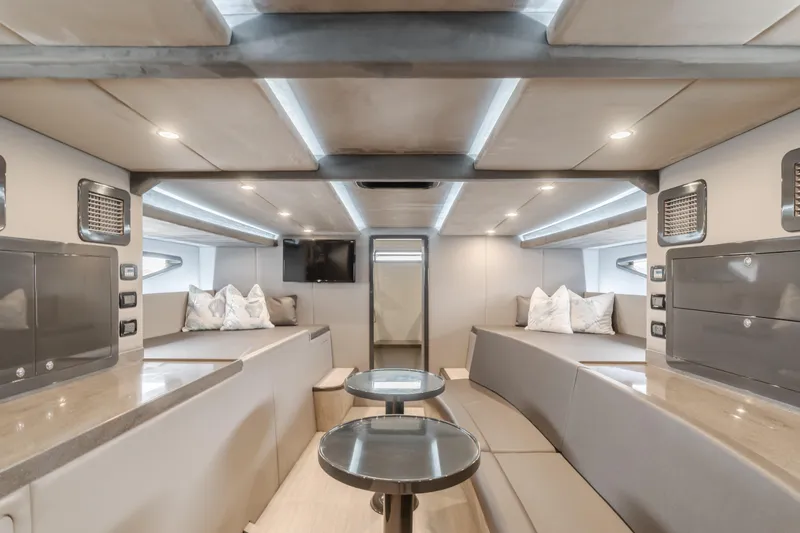 Slide: The Image of Luxurious interior of a 2017 Custom 60 yacht with modern seating and ambient lighting. - 36