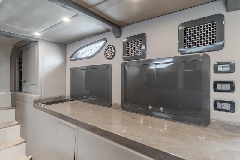 Slide: The Image of Modern interior of a 2017 Custom 60 yacht with sleek design and control panels. - 39