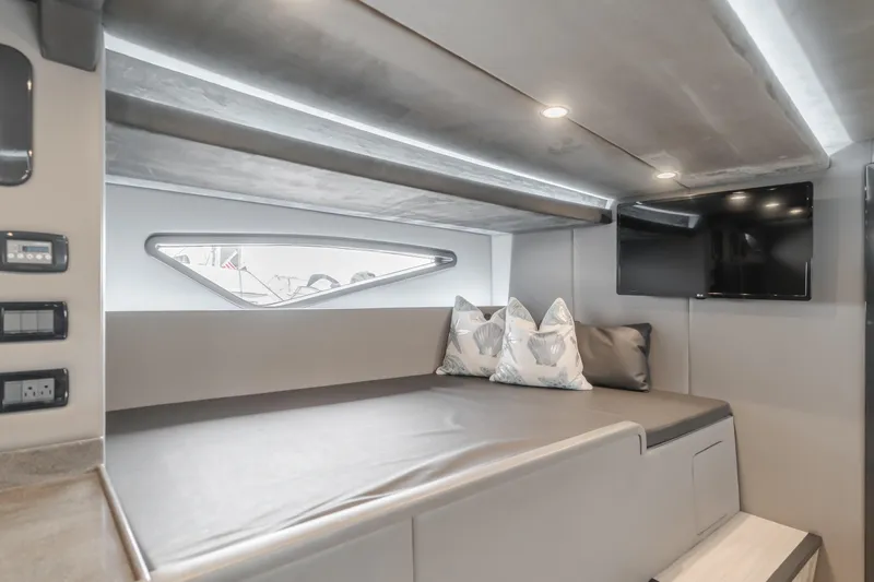 Slide: The Image of Luxurious interior of a 2017 Custom 60 yacht with modern seating and TV. - 42