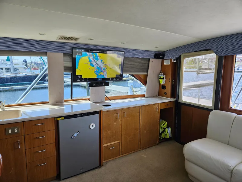 Slide: The Image of Interior of 1998 Ocean Yachts 40 Super Sport with modern amenities and marina view. - 15