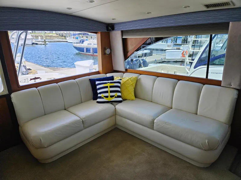 Slide: The Image of Luxurious interior of 1998 Ocean Yachts 40 Super Sport with white leather seating. - 17
