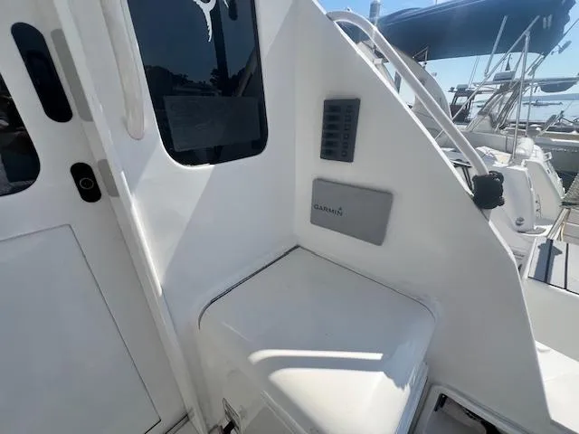 Slide: The Image of 1998 Ocean Yachts 40 Super Sport boat with Garmin equipment, docked at a marina. - 9