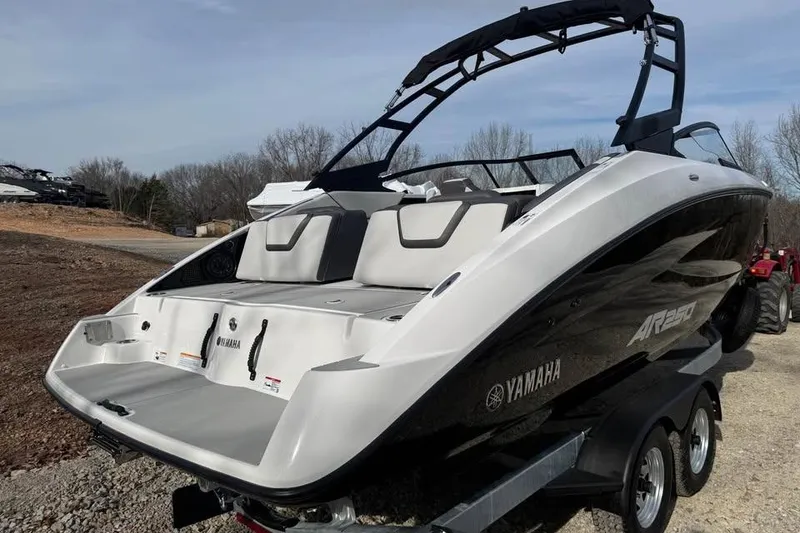 Slide: The Image of 2026 Yamaha Boats AR250 on trailer, sleek design, outdoor setting. - 5