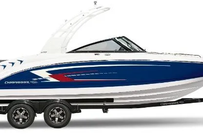 The Image of 2026 Chaparral 23 SSi boat with sleek blue and white design on a trailer. - 0