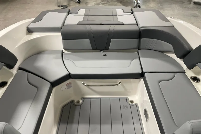 Slide: The Image of 2026 Chaparral 23 SSi boat interior with gray cushioned seating and sleek design. - 5