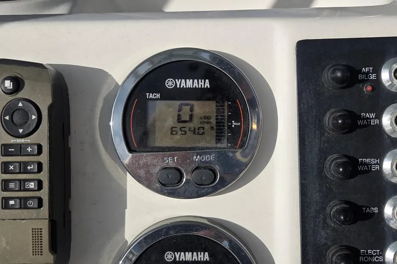 Slide: The Image of Yamaha tachometer and control panel on 2016 Robalo R222 Center Console boat. - 10