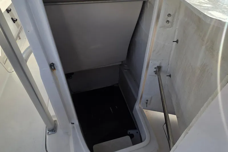 Slide: The Image of 2016 Robalo R222 Center Console storage compartment interior view. - 12