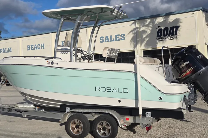Slide: The Image of 2016 Robalo R222 Center Console boat on trailer at dealership. - 2