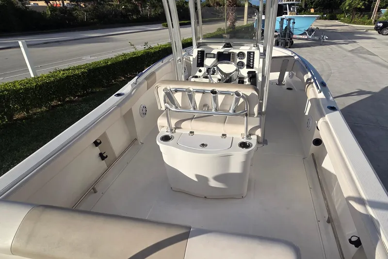 Slide: The Image of 2016 Robalo R222 Center Console boat interior with helm and seating. - 6