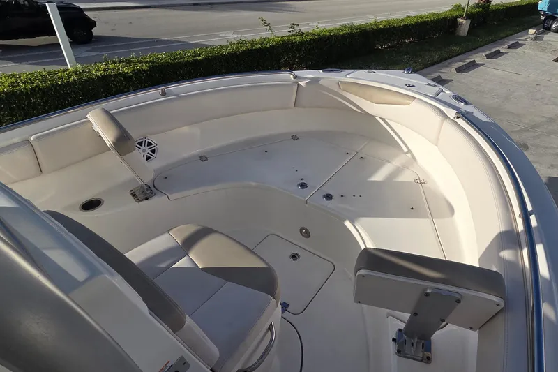 Slide: The Image of 2016 Robalo R222 Center Console boat interior with seating and storage compartments. - 7