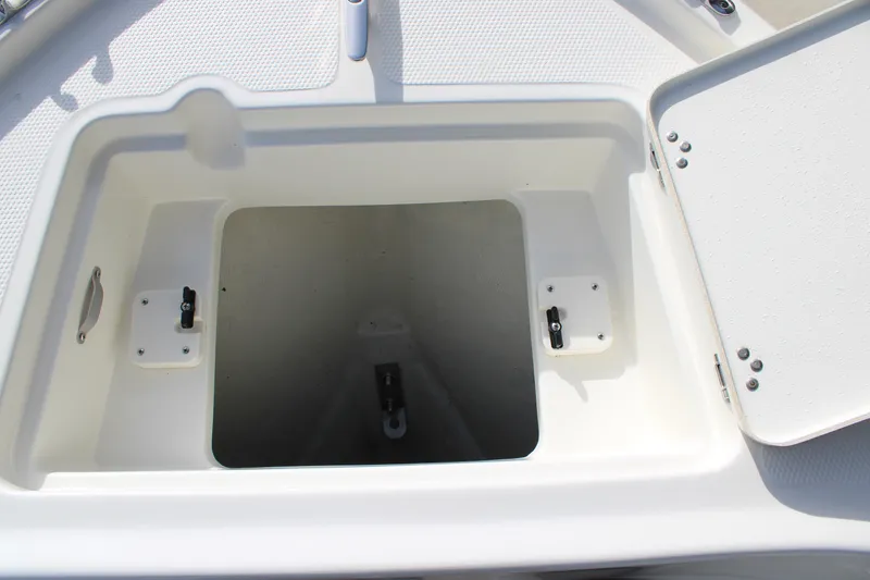 Slide: The Image of Open storage compartment on 2025 Mako 214 Center Console boat. - 11